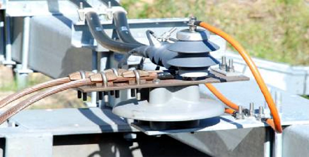 Overhead connection assembly with surge arrestor