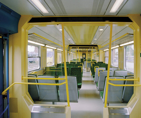 Train interior with handrails
