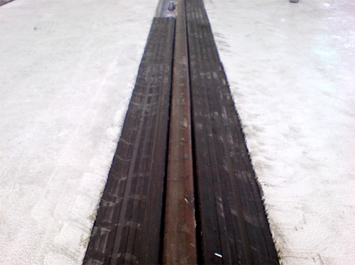 A safety profile in place on a level crossing rail track