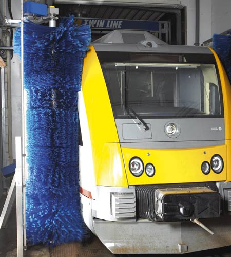 A train being washed in a twin line washer from Westmatic