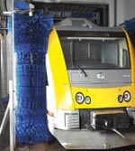 A train being washed in a twin line washer from Westmatic