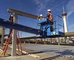 Beginning demolition work at a Sahara hotel parking lot, the future site of the Strip monorail maint